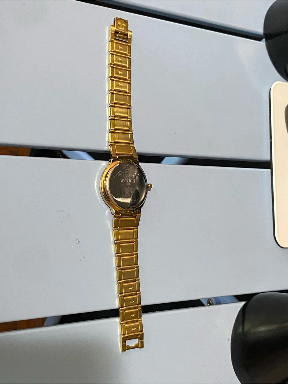 Pulsar Gold Watch Gold watch with gold dial, gold bracelet, and gold